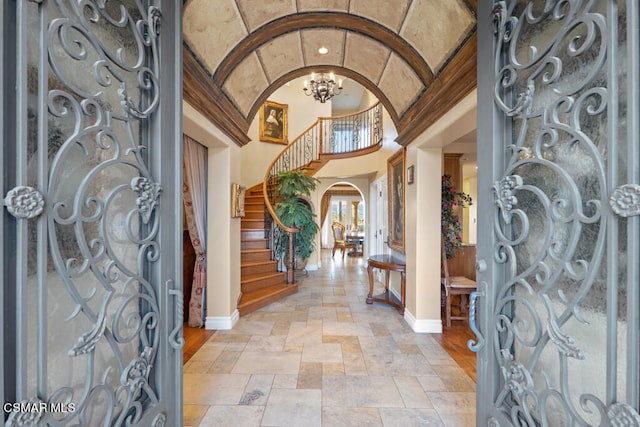 foyer entrance featuring a notable chandelier and light tile patterned floors