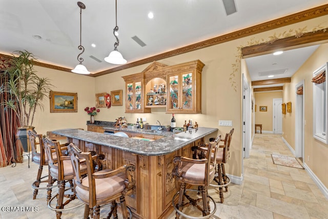 kitchen featuring a breakfast bar, dark stone countertops, pendant lighting, kitchen peninsula, and light tile patterned flooring