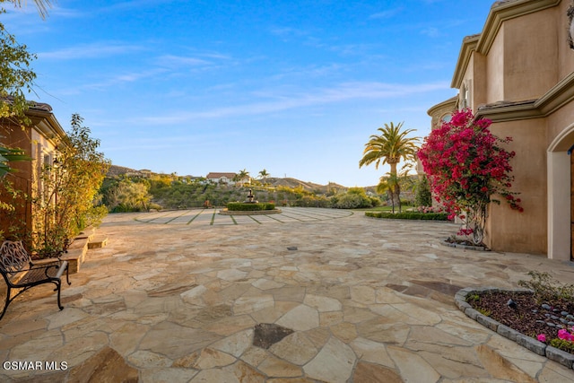 view of patio / terrace with a mountain view