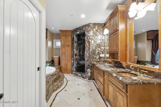 bathroom featuring tile patterned flooring, dual vanity, and independent shower and bath