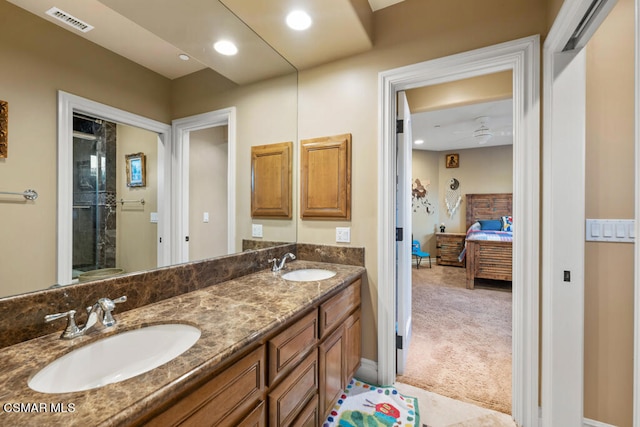 bathroom with ceiling fan and dual bowl vanity