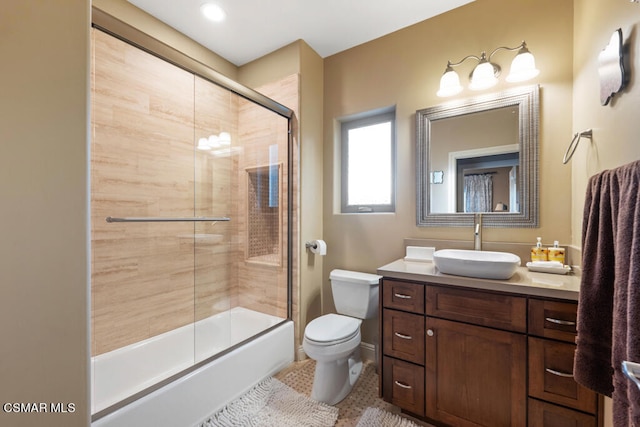 full bathroom with vanity, toilet, tile patterned flooring, and enclosed tub / shower combo