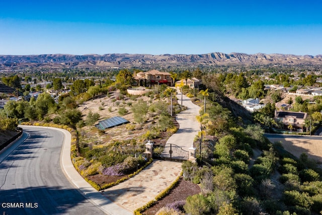 birds eye view of property with a mountain view