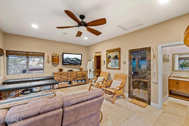 living room featuring light tile patterned floors and ceiling fan