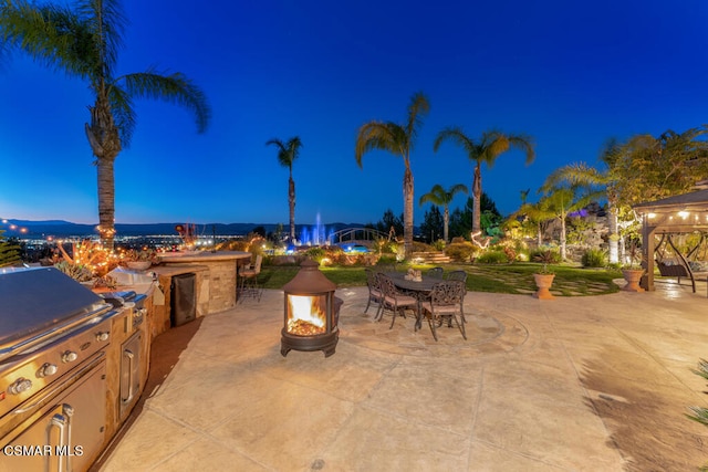 view of patio / terrace with a gazebo and an outdoor fire pit