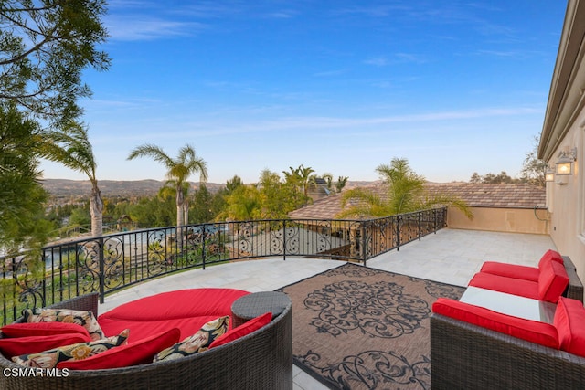 view of patio featuring a balcony