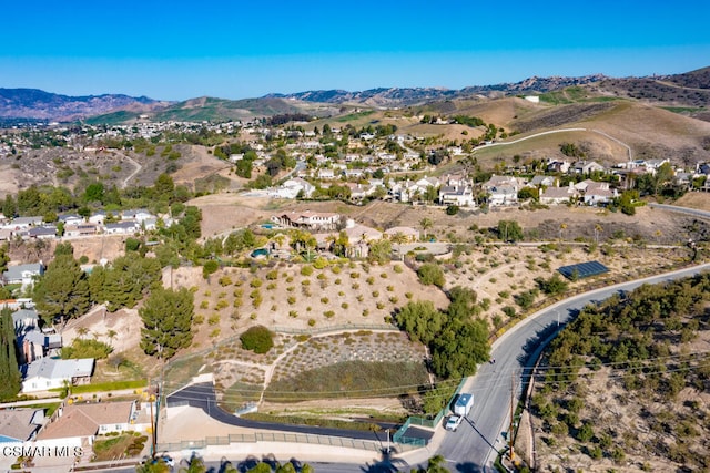 birds eye view of property with a mountain view