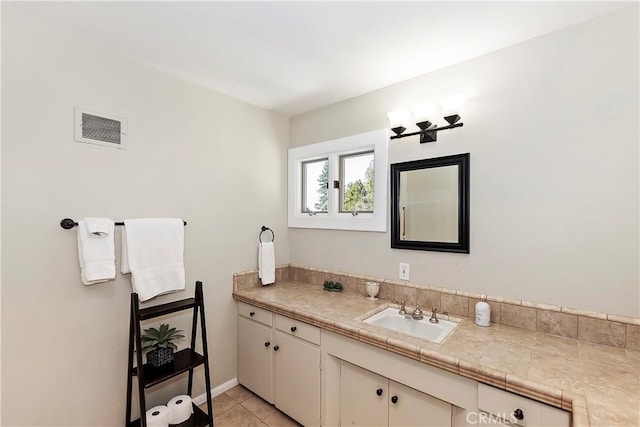 bathroom featuring tile patterned floors and vanity