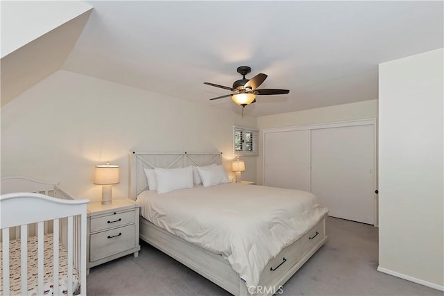 bedroom with carpet, a closet, and ceiling fan