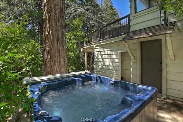 view of pool featuring a hot tub