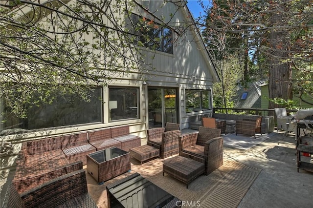 deck with an outdoor hangout area and a patio