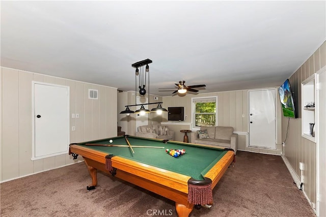 recreation room with wood walls, ceiling fan, dark carpet, and pool table