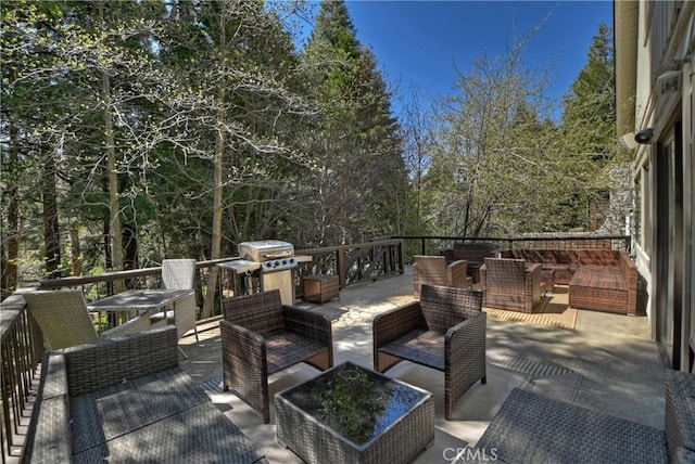 deck with an outdoor hangout area