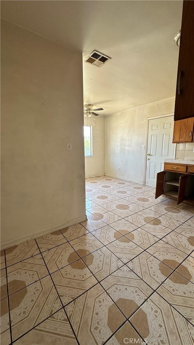 unfurnished room featuring ceiling fan