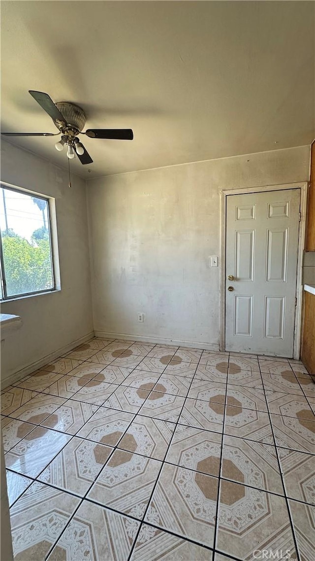 unfurnished room featuring ceiling fan