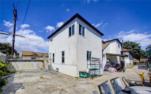 back of house with a patio area