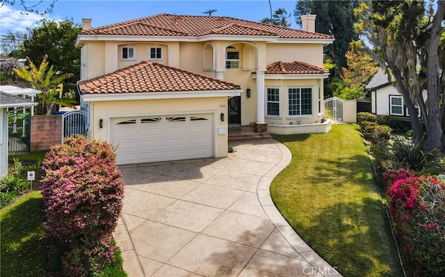 mediterranean / spanish-style home featuring a garage and a front yard