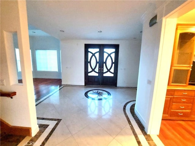 7264 W 88th Pl, Los Angeles, CA 90045 - foyer featuring inlaid floor details, french doors, baseboards, and tile patterned floors