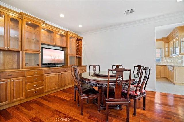 7264 W 88th Pl, Los Angeles, CA 90045 - dining area featuring ornamental molding, dark wood-style floors, and recessed lighting