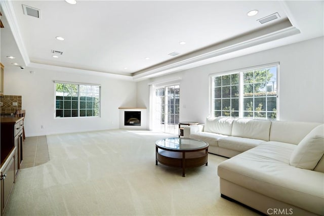 7264 W 88th Pl, Los Angeles, CA 90045 - living area with a tray ceiling, light carpet, recessed lighting, and a fireplace