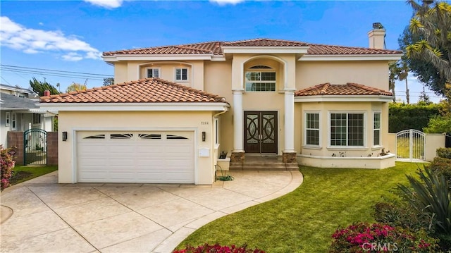 mediterranean / spanish-style home with a garage and a front lawn