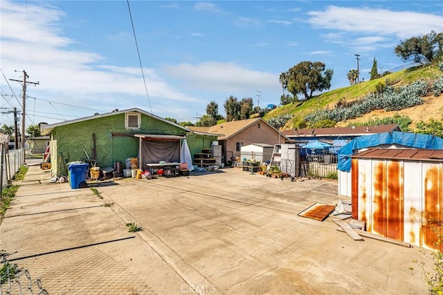 exterior space with a storage shed