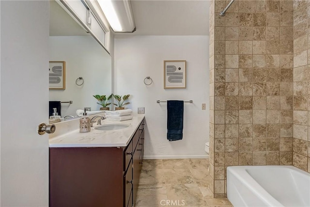 full bathroom featuring tiled shower / bath, vanity, and toilet