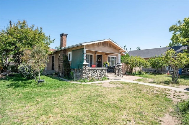 view of front of home with a front lawn and a porch