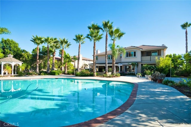 view of swimming pool featuring a gazebo