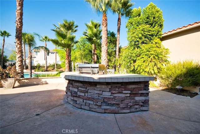 view of patio with area for grilling