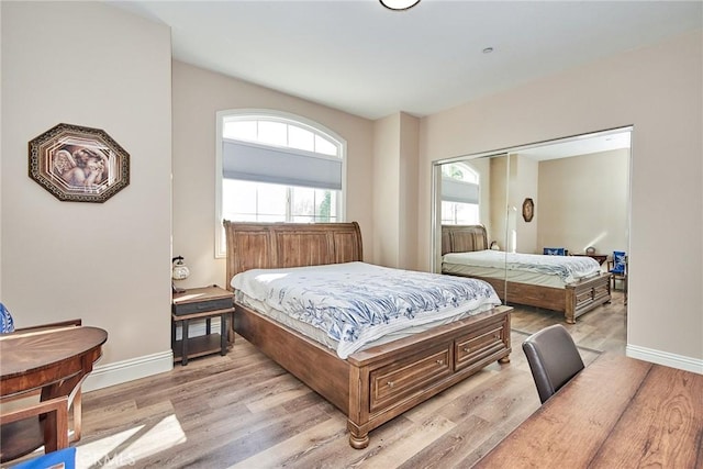 bedroom with a closet and light wood-type flooring