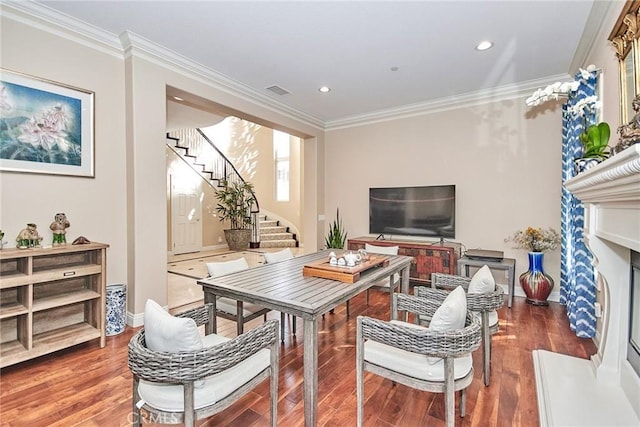 interior space featuring wood-type flooring and ornamental molding