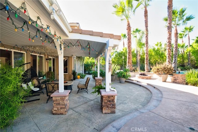 view of patio / terrace featuring a fire pit