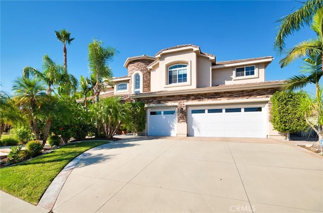 mediterranean / spanish-style house with a garage