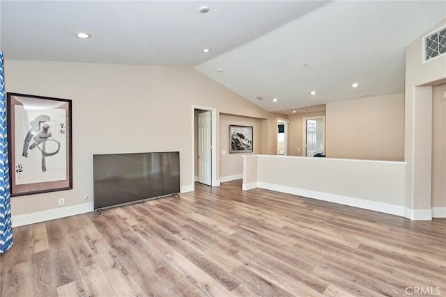 unfurnished living room featuring light hardwood / wood-style floors and vaulted ceiling