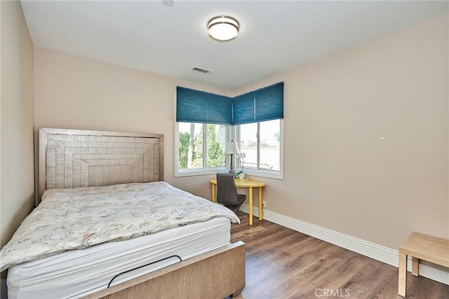 bedroom featuring hardwood / wood-style floors