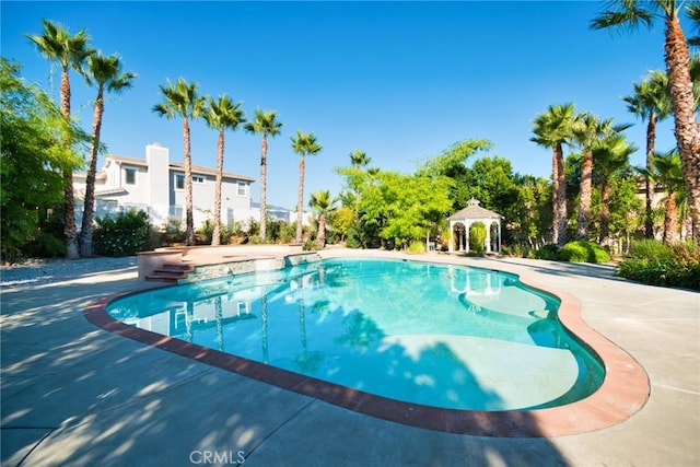 view of swimming pool featuring a gazebo and a patio area