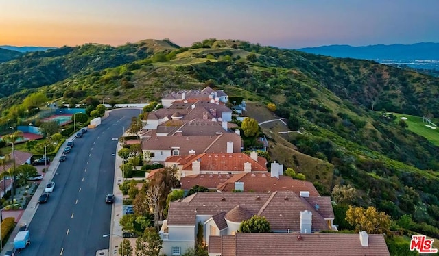 aerial view at dusk with a mountain view