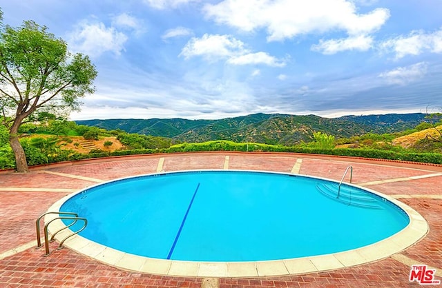 view of pool featuring a mountain view