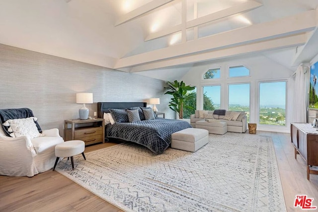 bedroom with high vaulted ceiling, beamed ceiling, and wood-type flooring