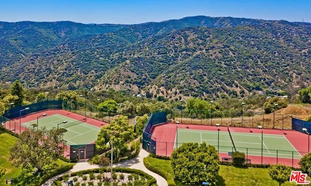 birds eye view of property with a mountain view