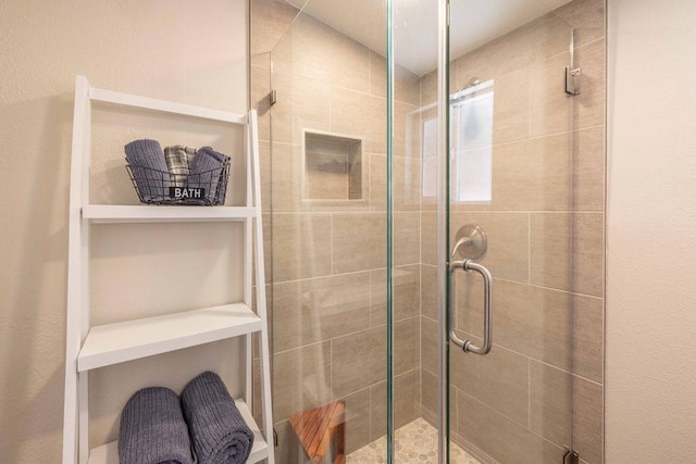 bathroom featuring an enclosed shower