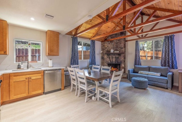 interior space with light hardwood / wood-style floors, plenty of natural light, and sink