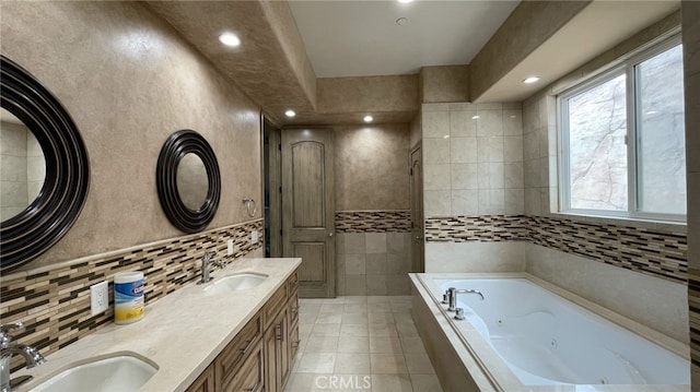 bathroom with tile walls, double vanity, tile flooring, and a tub