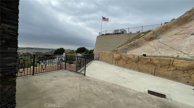 view of patio featuring a balcony