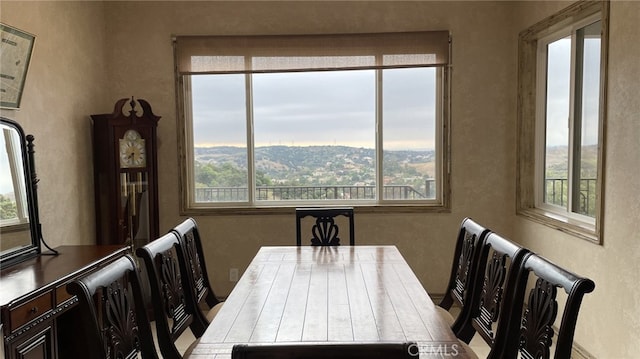 dining area with plenty of natural light and a mountain view