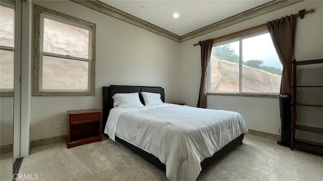 carpeted bedroom featuring crown molding