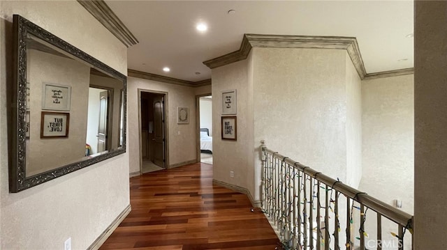 hallway with dark wood-type flooring and crown molding