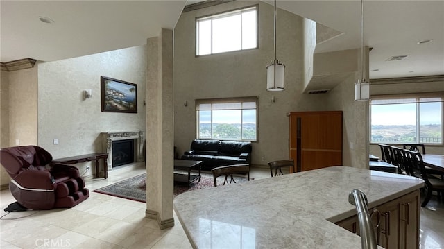 interior space with a towering ceiling and tile floors