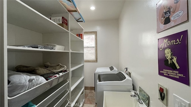 washroom featuring tile floors, sink, washer hookup, and independent washer and dryer